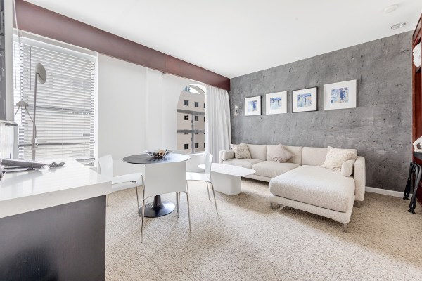 Interior of a hotel room decorated in white