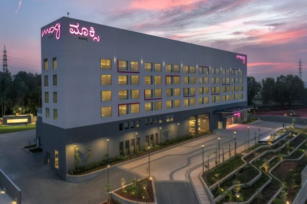 Exterior of a hotel in the early evening