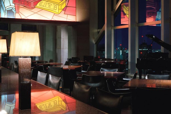 interior of a bar on the top floor of a hotel at nighttime