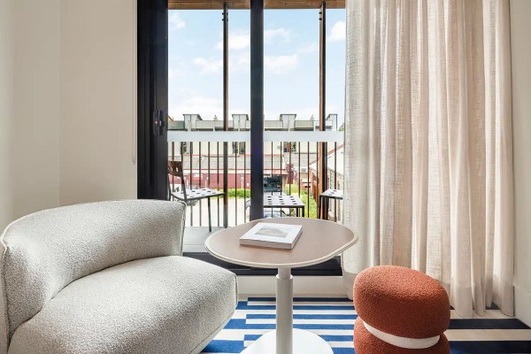 a couch and table in front of a sliding glass door