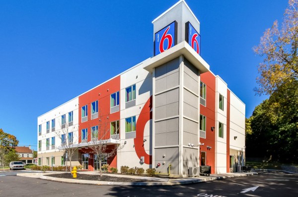 The exterior of a three-story motel.