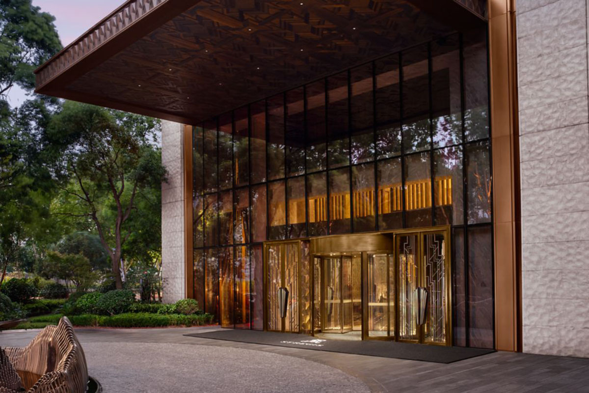 A glass and brass fronted porte cochere.