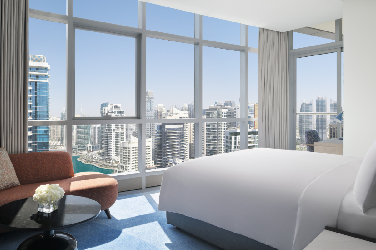 a hotel room overlooking Dubai's skyline