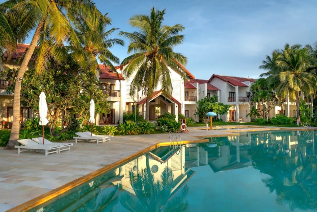 image of an all inclusive resort sunny day with a pool